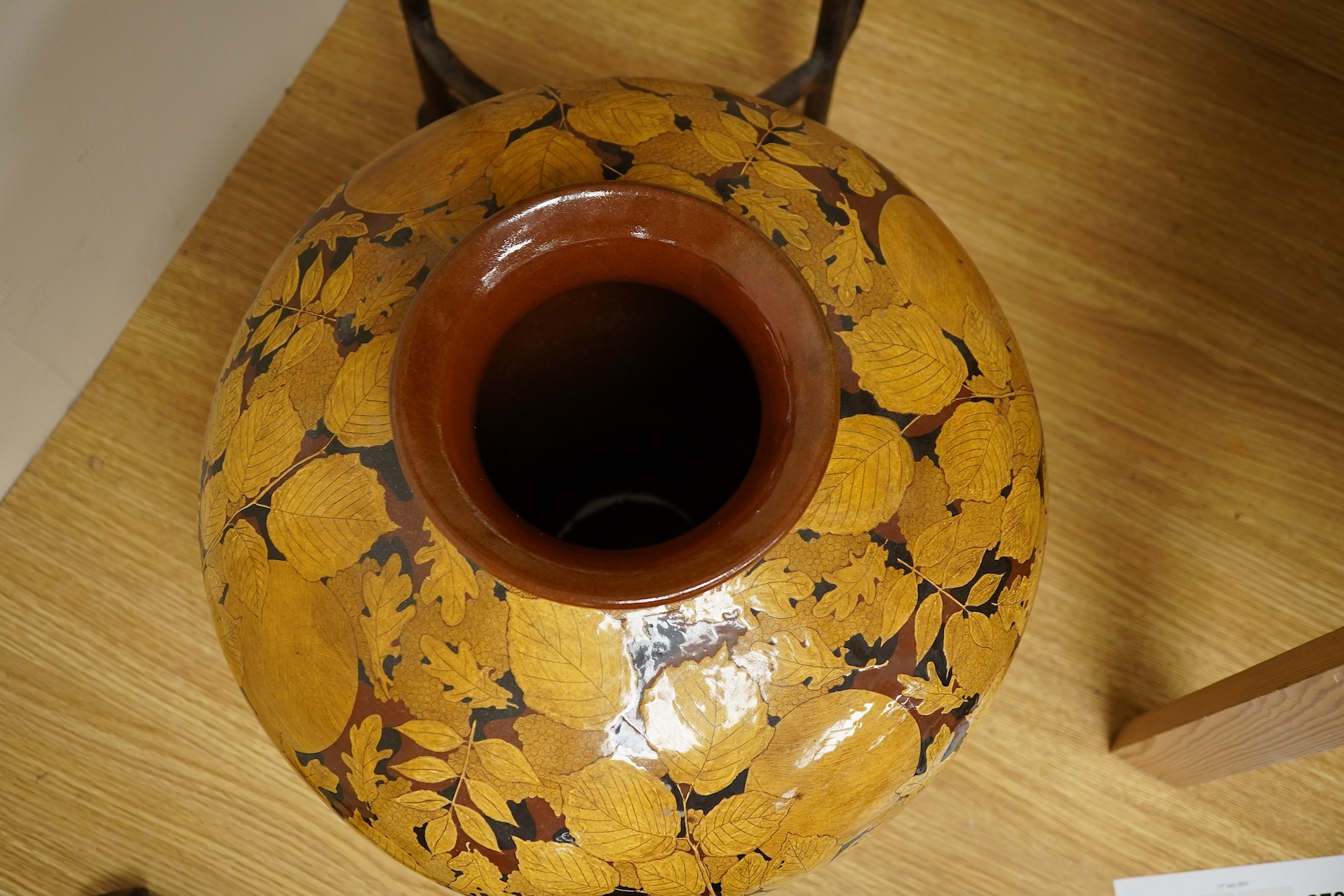 A large terracotta foliaiate decorated vase, 38cm high